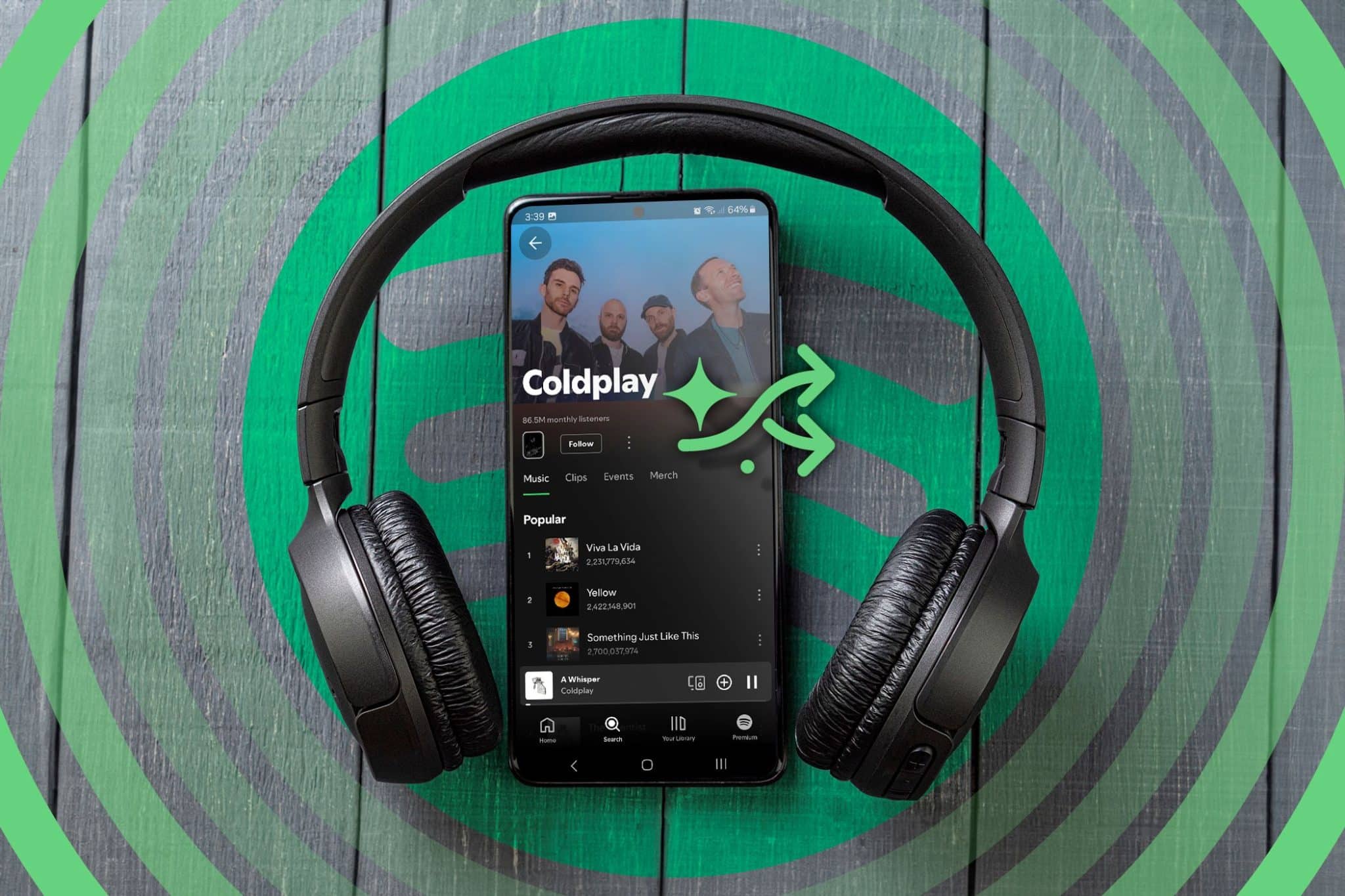 耳機和手機上顯示著 Spotify 應用程式。