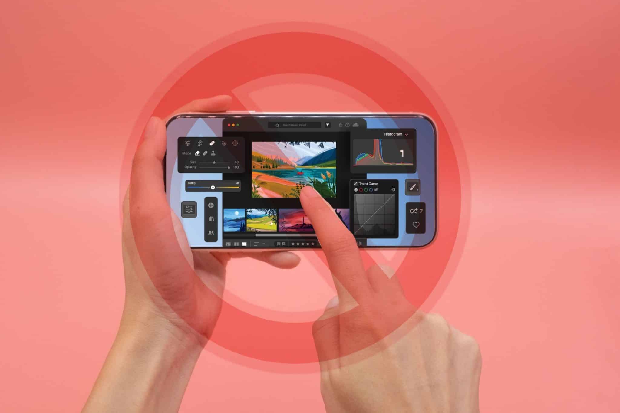 Mano che tiene uno smartphone con editor fotografico e cartello di divieto