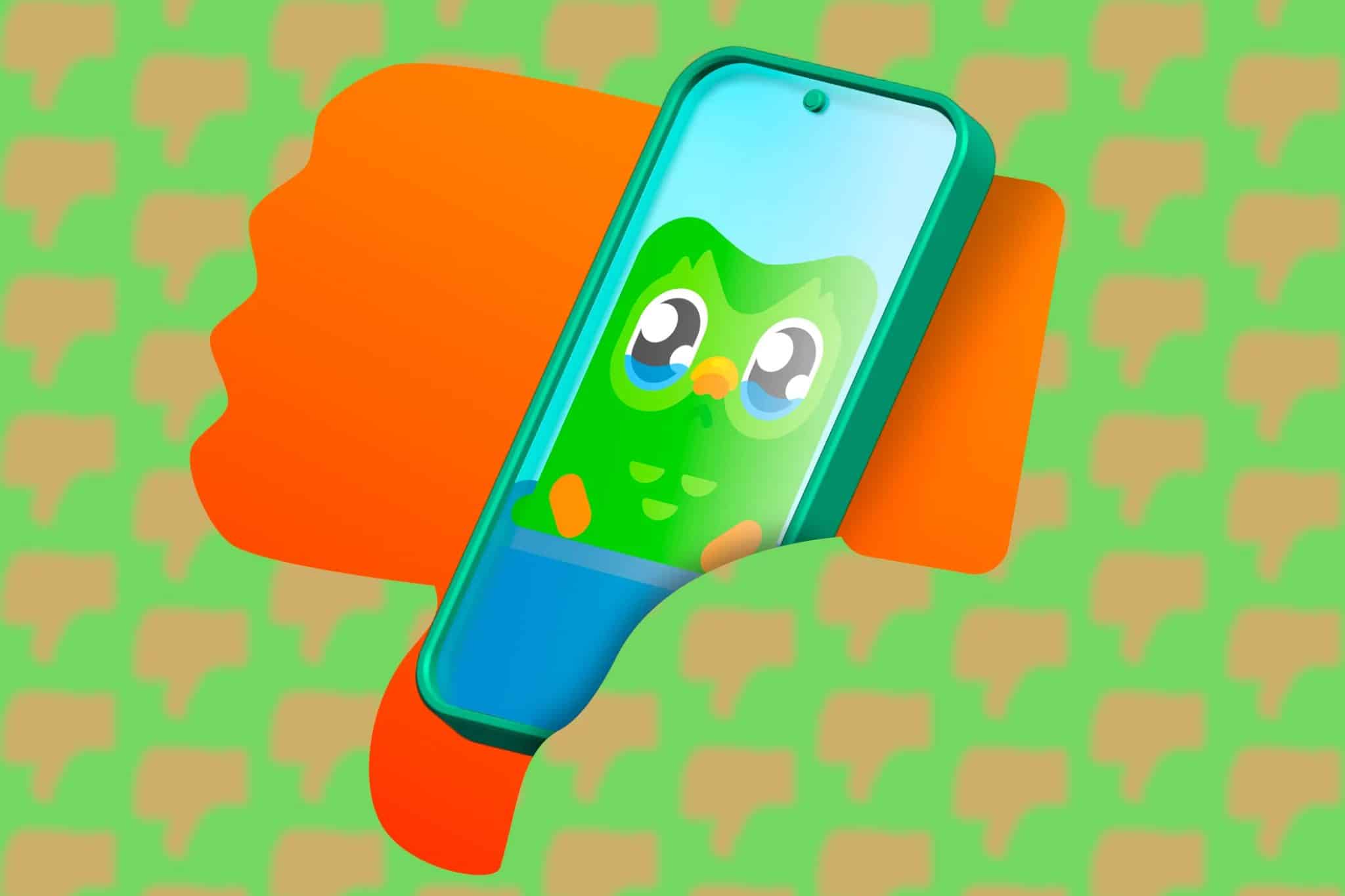 一部手機上印有 Duolingo 的圖像,該圖像來自一個拇指向下的圖示。