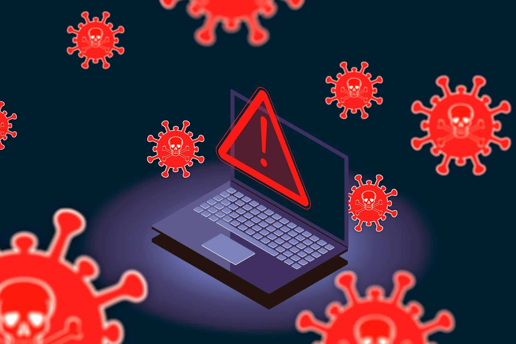 Computer portatile con icona di avviso circondata da virus.