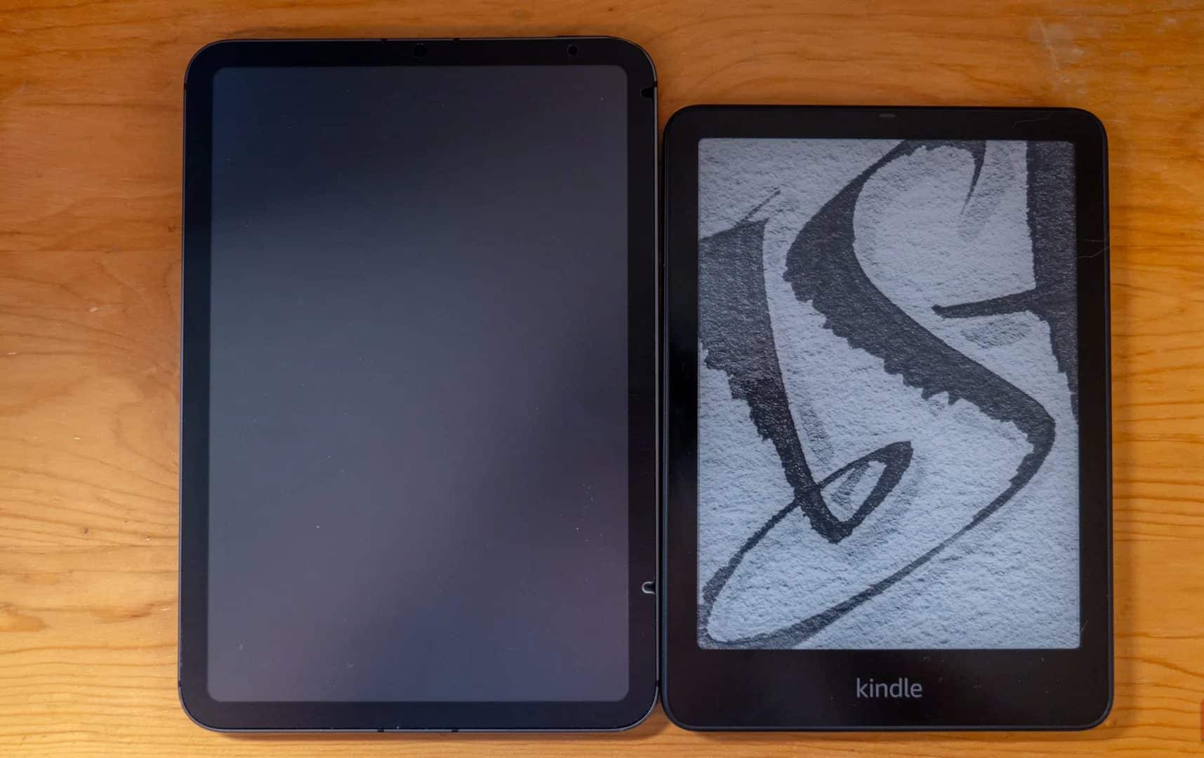 Amazon Kindle Paperwhite Signature Edition next to an iPad mini.