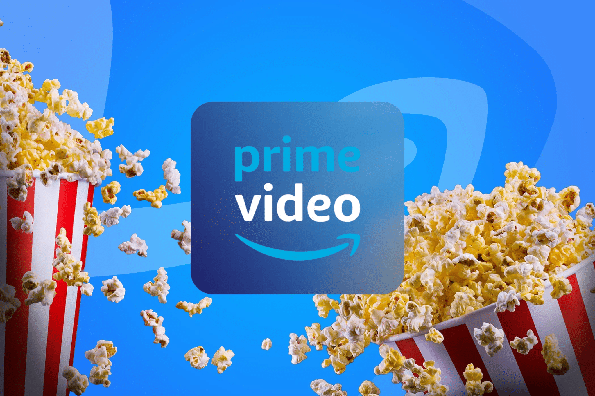 Logo Prime Video su sfondo blu, circondato da popcorn volanti e secchielli per popcorn con strisce rosse