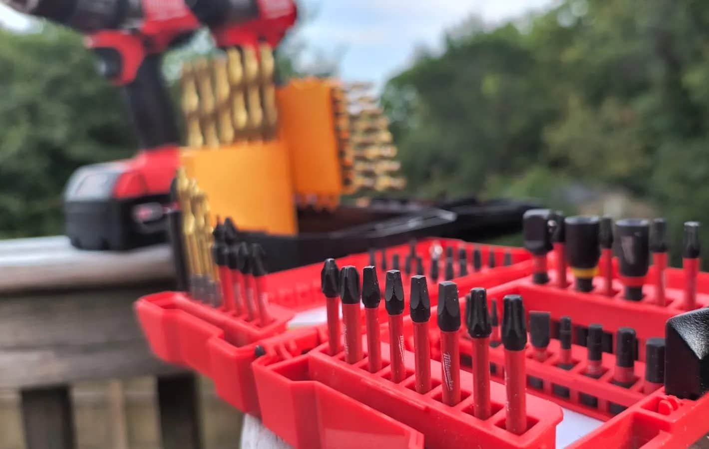 Drill and driver bits on a wooden rail